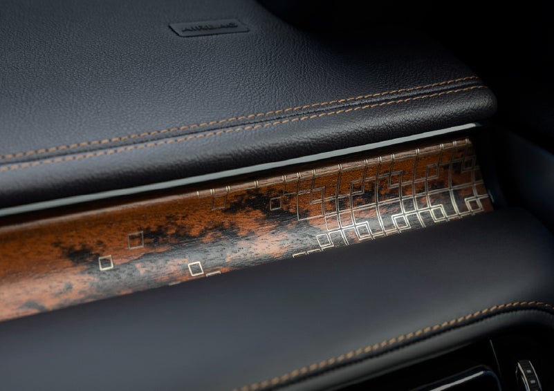 A close-up shot of the 2026 Lincoln Aviator® dashboard with unique black and brown accents and brown stitching. | Crest Lincoln in Sterling Heights MI