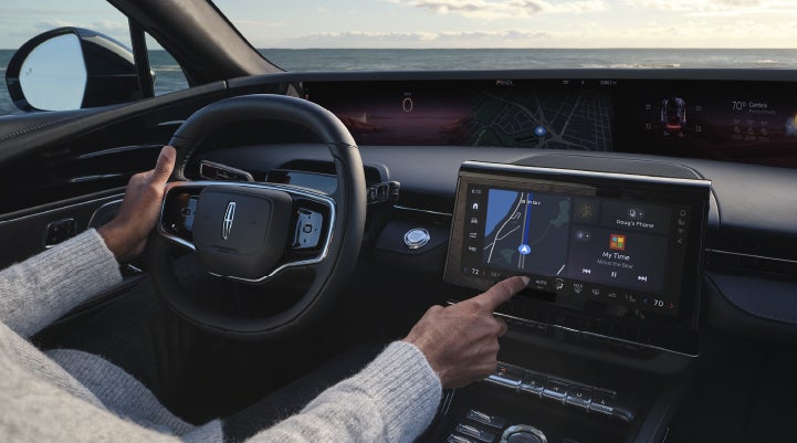 The driver of a 2026 Lincoln Nautilus® SUV interacts with the new Lincoln Digital Experience. | Crest Lincoln in Sterling Heights MI
