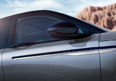 Blue lettering on the side of the vehicle that reads Nautilus indicates the available Hybrid Powertrain. | Crest Lincoln in Sterling Heights MI