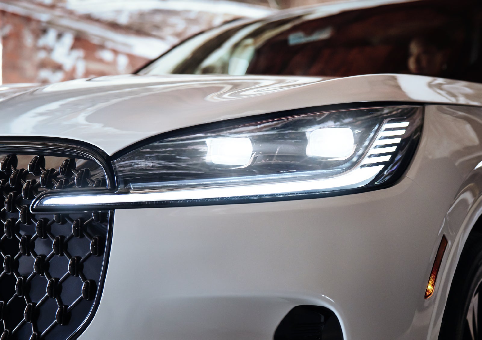 A close-up of a headlamp on the 2027 Lincoln Aviator® SUV is shown. | Crest Lincoln in Sterling Heights MI