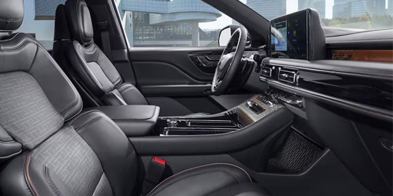 Interior view of a Lincoln Aviator with black leather seats.