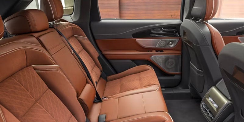Rear row seating of a car in brown and black
